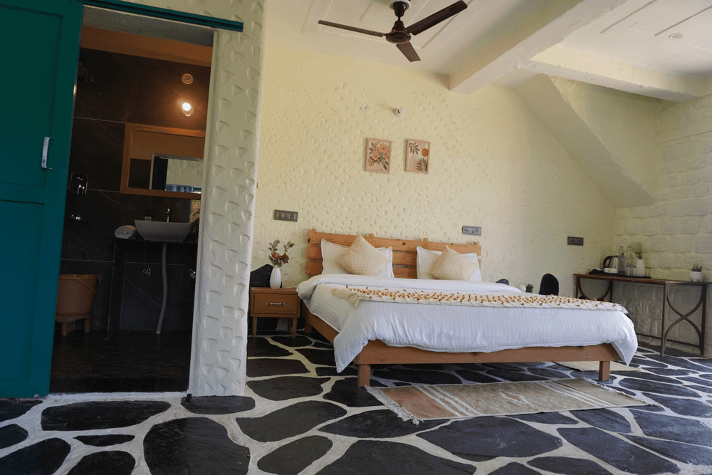 Double bed with the attached bathroom door open
