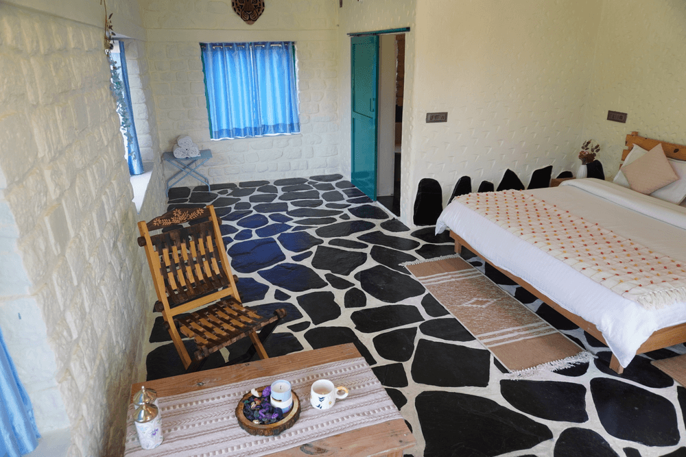 Folding chair and tea tray beside the bed