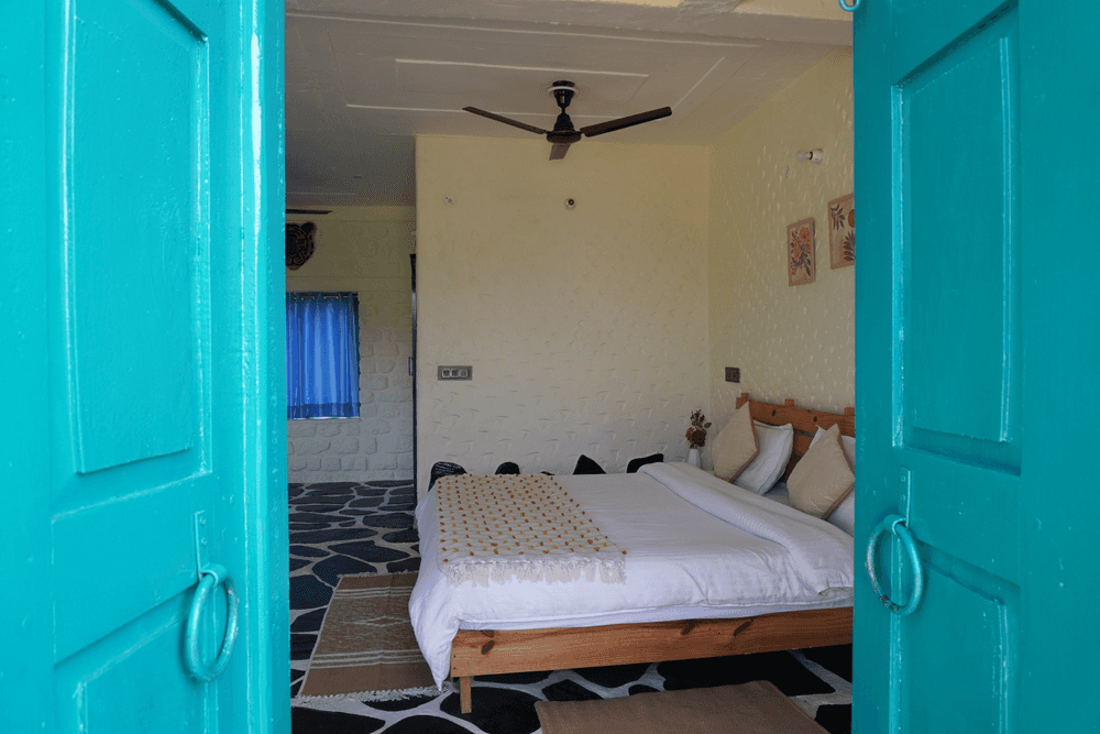 View into the room through the teal doors
