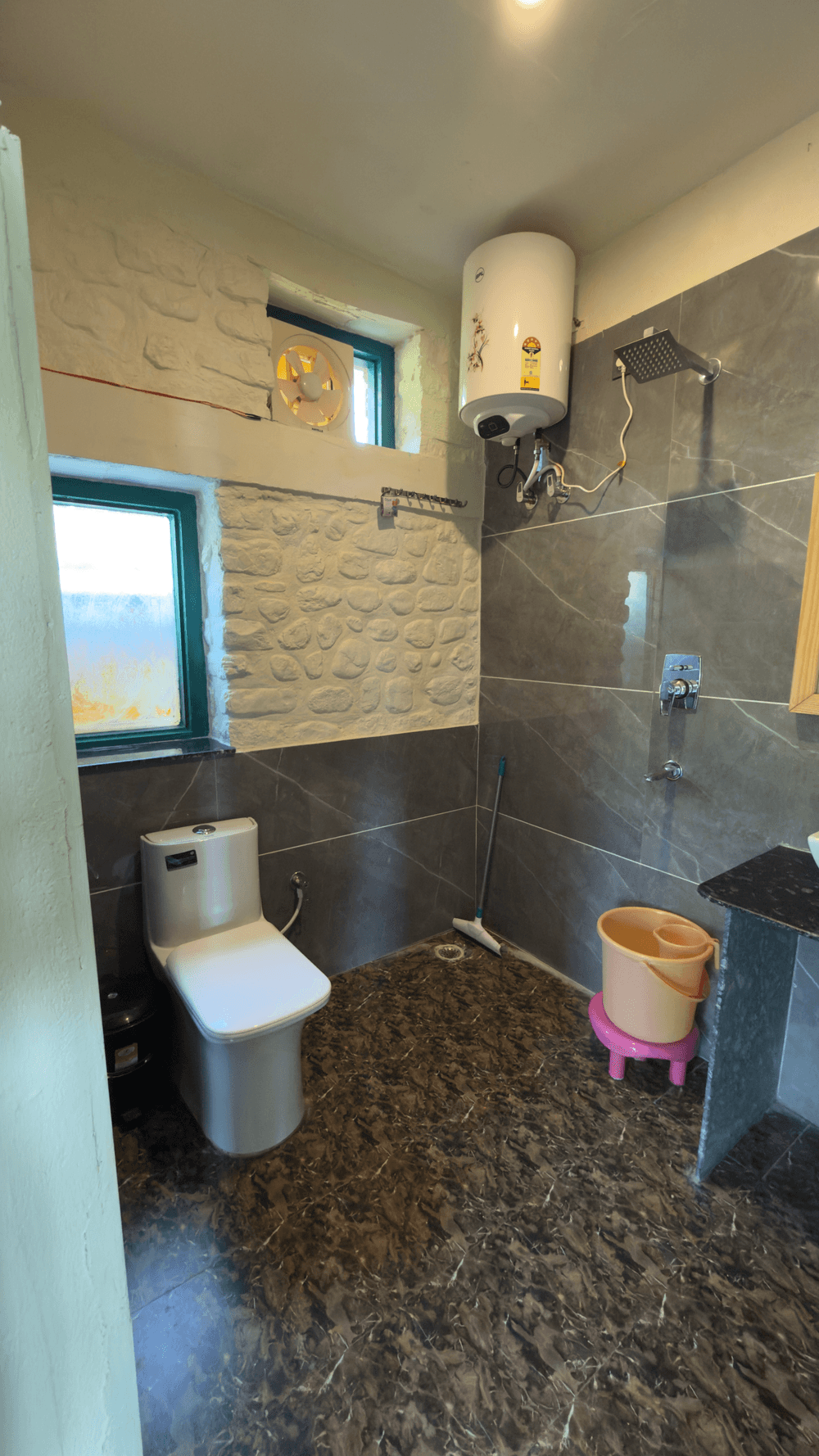 Attached bathroom with western toilet and geyser
