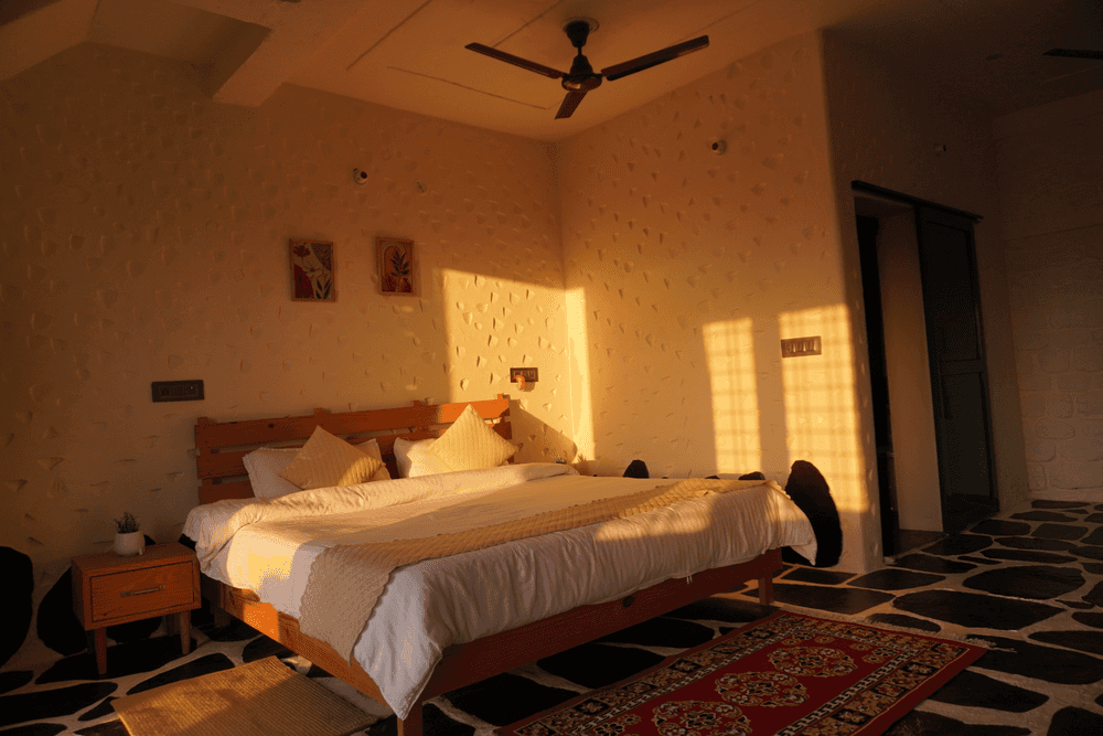 Bed lit by the evening sun