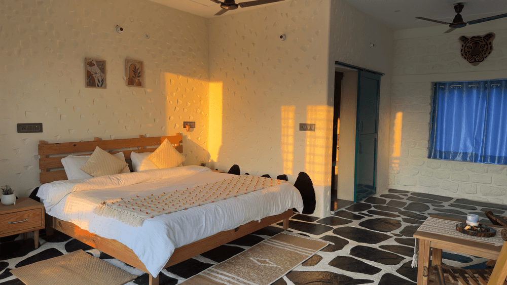 Double bed with sunlight on the stone wall