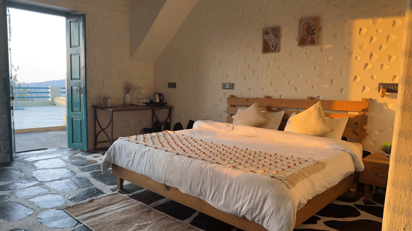 Stone Room South: double bed with the door open to the terrace