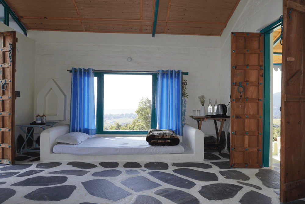 Window seat between carved wooden doors