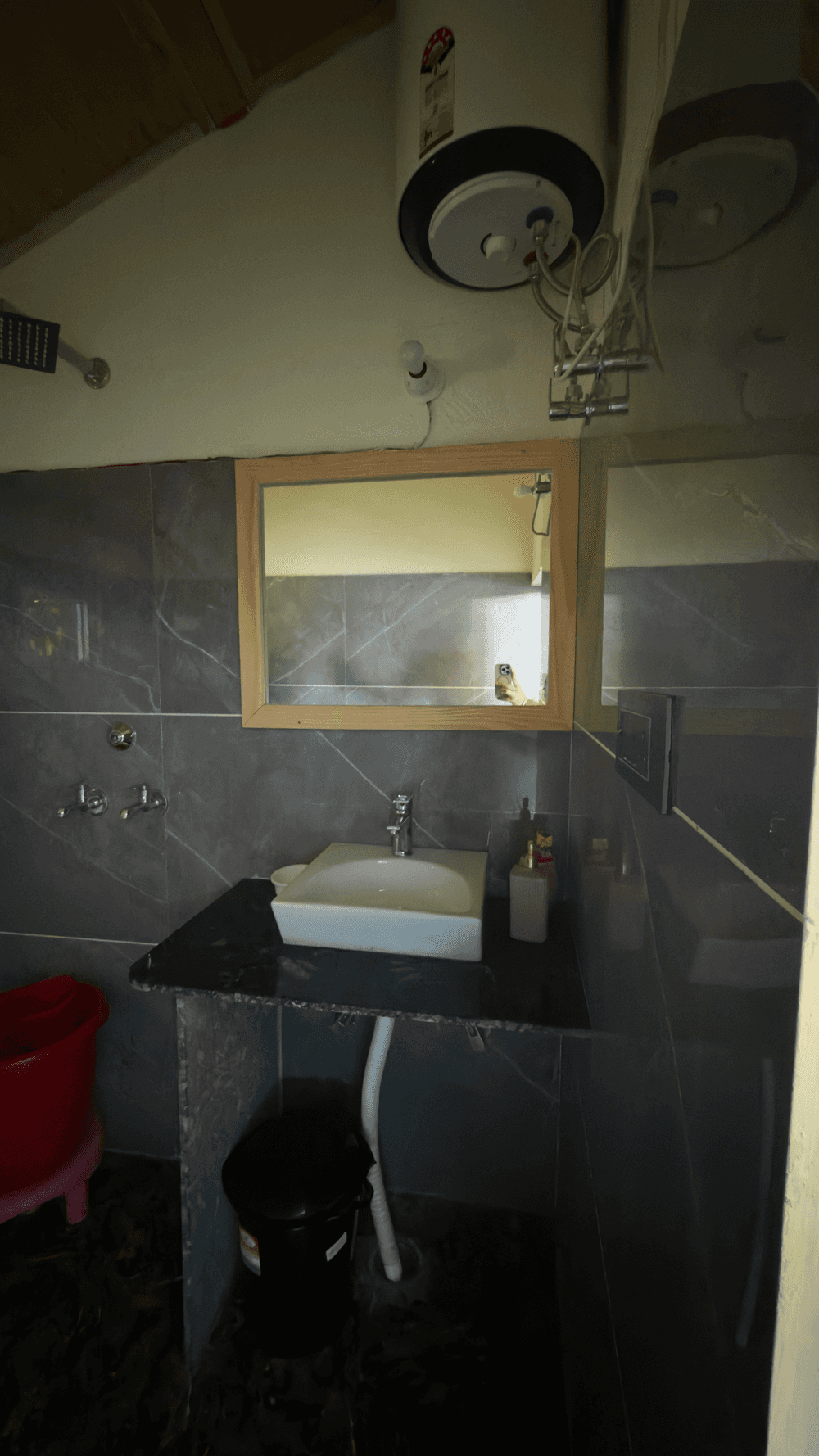 Attached bathroom with washbasin and geyser